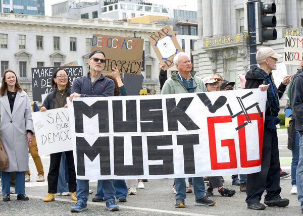 San Francisco, CA - March 4, 2025: Participants at a 50501 protest in front of City Hall. Protesting government corruption, economic inequality and human rights abuses.