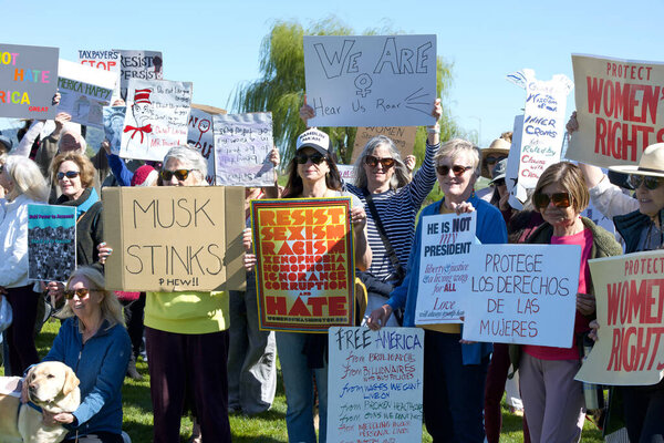 Sausalito, CA - March 8, 2025: Participants in an International Women's Day Protest. Calling for equal pay, reproductive rights, education and justice among other topics.