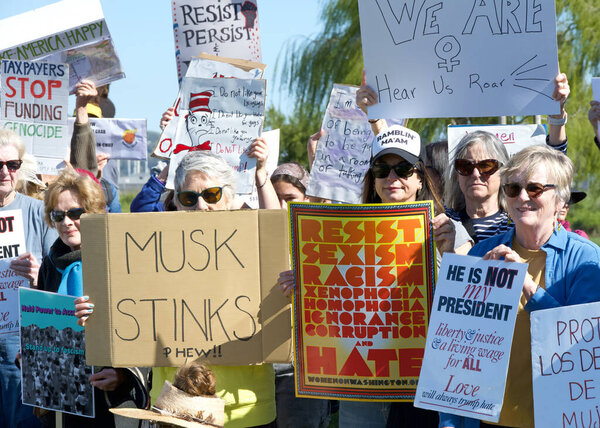 Sausalito, CA - March 8, 2025: Participants in an International Women's Day Protest. Calling for equal pay, reproductive rights, education and justice among other topics.