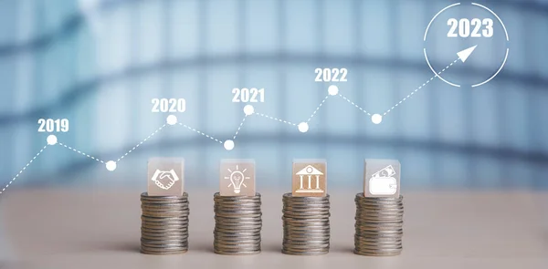 Double exposure of coins on the white background for finance and banking and Money spending planning, and investment budget, Business saving money concept, Copy space, new year 2022-2023 concept