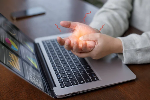 Office syndrome with hand pain by occupational disease, Woman holding her hand pain from using laptop or smartphone long time,Health care and medical concept, wrist pain.