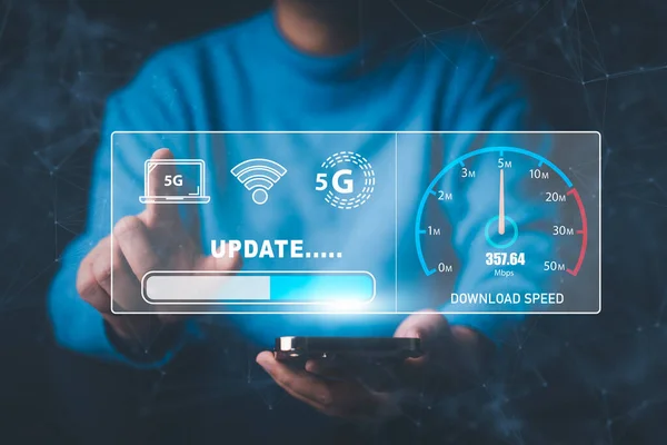 Fast internet connection with Metaverse technology concept, Hand holding smartphone and Virtual screen of Internet speed measurement,Internet and technology concept, 5G Hi speed internet concept