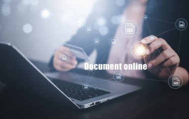 Businesswoman working on laptop with virtual screen. Online documentation database, IT consultant being set up Virtual Document Management System with laptop,Software for archiving corporate files.
