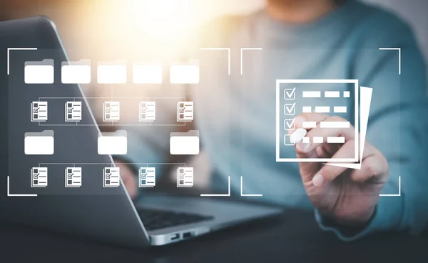 stock image Businesswoman working on laptop with virtual screen. Online documentation database, IT consultant being set up Virtual Document Management System with a laptop, Software for archiving corporate files.