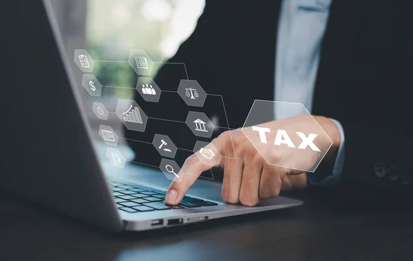 Business people Hand using tablets with bar  TAX REFUND and refund tax of duty taxation business, graphs and charts being demonstrated on the screen media,  tablet pc and selecting tax refund.