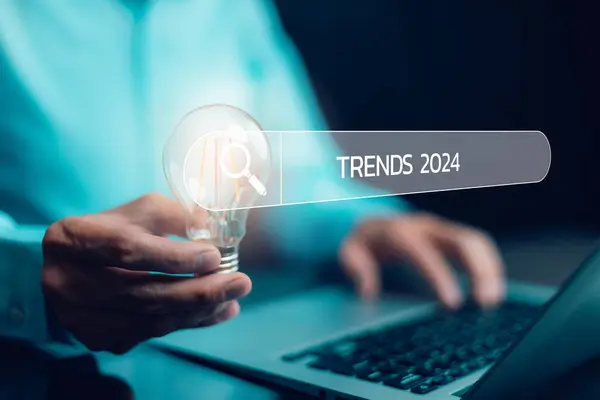 Businessman using laptop computer search 2024 trends,happy new year concept digital trends,industry and business trend of world full modernity advanced technology,artificial intelligence or AI,banner