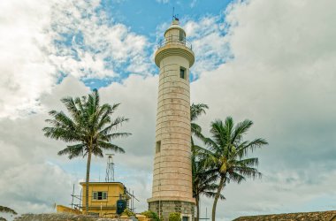 09 07 2007 Lighthouse in Galle fort, Sri Lanka. Indian ocean shore, palms, blue cloudy sky.Sri Lanka.
