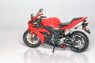 03 12 2006 Toy Red and black plastic motorcycle on a white background Lokgram Kalyan Maharashtra India