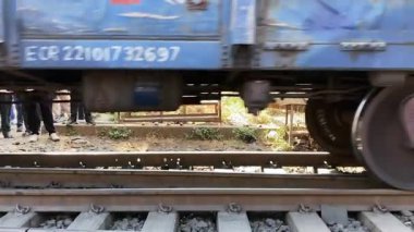 01 31 2025 Goodes Wagon Train under structure on the train track, Train wheels on the railway, Goodes Yard, Kalyan, Maharashtra, India, Asia