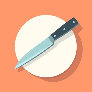 Beyaz bir tabağın tepesinde bir bıçak