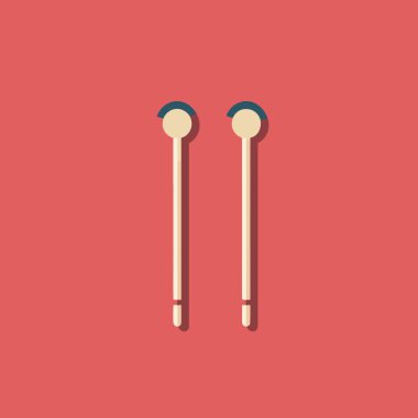 Kırmızı bir yüzey üzerinde oturan bir çift kulaklık.