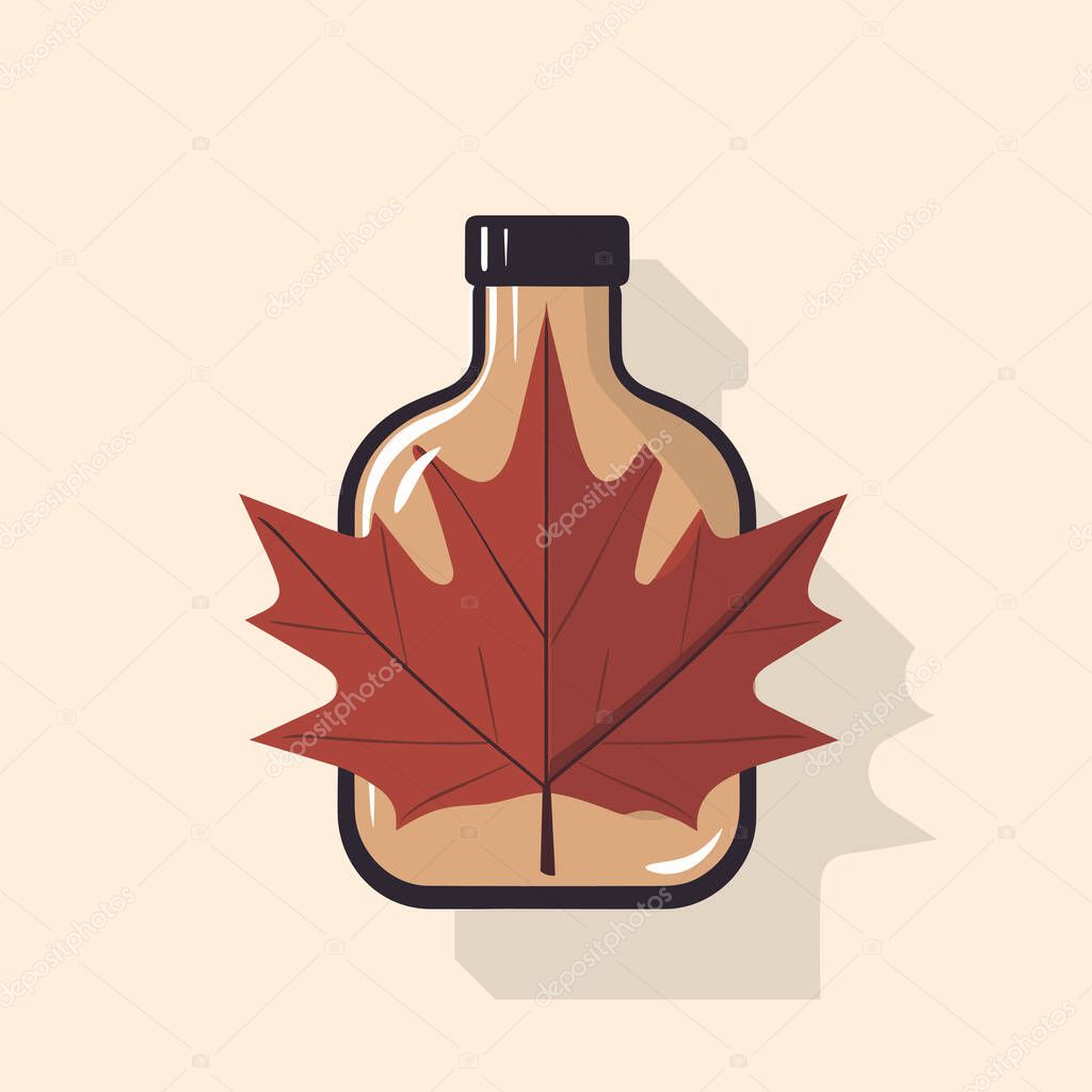 A bottle of maple syrup with a leaf on it
