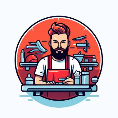 Sakallı bir adam dizüstü bilgisayarla çalışıyor.