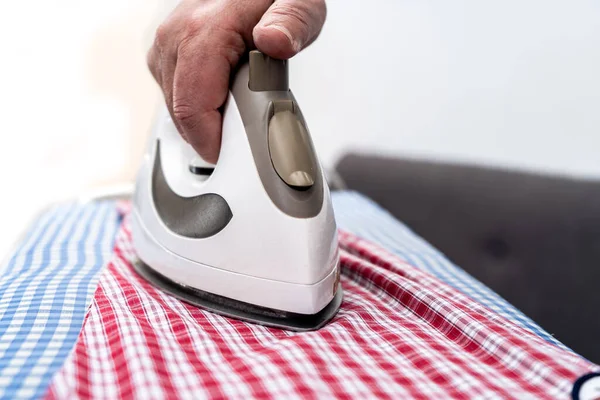 Close Man Hand Holding Iron While Ironing Shirt Board Concept — Stock Photo, Image