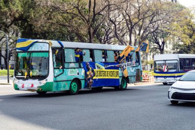 Buenos Aires, Argentina, 09-21-2024, Bus transfer for Boca Juniors football club fans to the Super Clasico against River Plate. clipart