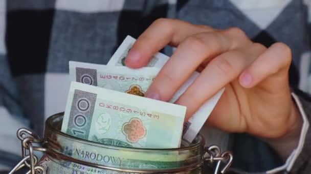 Polish Zloty Banknote Saving Money Glass Jar Unrecognizable Woman Moderate — Stock video