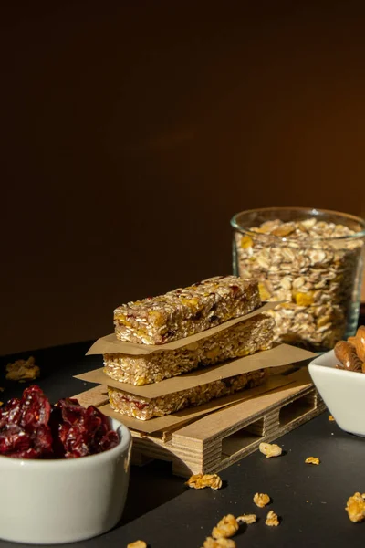 Homemade natural Granola energy bar. Variety of homemade Protein granola breakfast bars ingredients nuts, raisins dried cherries and chocolate. Healthy nutrition eating. Gluten free cereal dieting