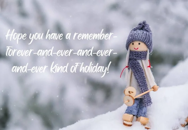 Hope you have a remember-forever-and-ever-and-ever-and-ever kind of holiday Inspiration joke quote phrase Angel gnome in scarf and knitted hat skiing on snowy fir branch Elf toy on skis in snowy