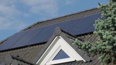 New ecologic house with solar panels Alternative to conventional energy. The battery is charged from a solar cell Advertisement Green energy Sustainable life Renewable alternative energy 