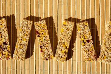 Homemade natural Granola energy bar. Variety of homemade Protein granola breakfast bars, with nuts, raisins dried cherries and chocolate. Healthy nutrition eating. Gluten free cereal dieting snack
