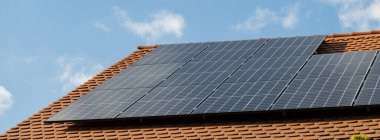 New ecologic house with solar panels Alternative to conventional energy. The battery is charged from a solar cell Advertisement Green energy Sustainable life Renewable alternative energy 