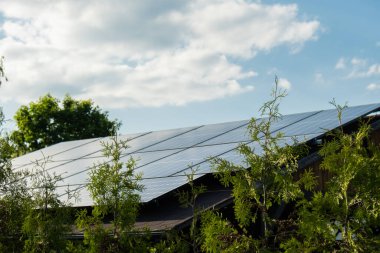 New ecologic house with solar panels Alternative to conventional energy. The battery is charged from a solar cell Advertisement Green energy Sustainable life Renewable alternative energy 