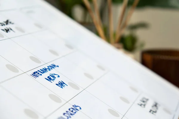 INTERNATIONAL MENS DAY on calendar to remind important event or holiday appointment Monthly PLANNER. Magnetic board with the days of the month. Place to enter important matters schedule. Concept for