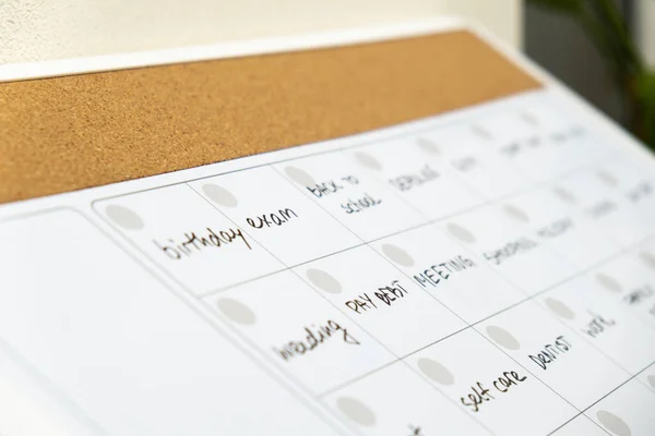 stock image Monthly PLANNER filled with appointments and plans for next month. Busy month schedule. Magnetic board with the days of the month. Place to enter important matters schedule. Concept for business