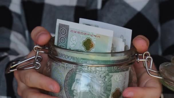 Polish Zloty Banknote Saving Money Glass Jar Unrecognizable Woman Moderate — Stock Video