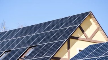 4k zoom in out New ecologic house with solar panels Alternative to conventional energy. The battery is charged from a solar cell Advertisement Green energy Sustainable life Renewable