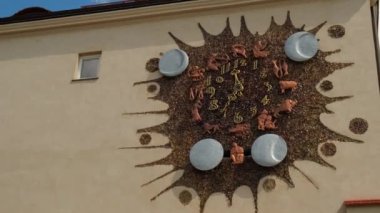 Warsaw Poland - May 2022 Clock with zodiac signs on the wall of a building in the old town. Zodiac clock on the building wall. Travel attraction tourist destination 