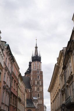 St. Marys Basilica on the Krakow Main Square Rynek Glowny Poland. Krakow architecture, old city architecture. Historic Roman Catholic church in Krakow Baroque architecture Travel tourist attraction 