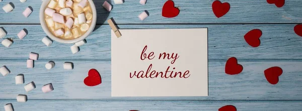 BE MY VALENTINE text Banner Romantic Valentine day Greeting card with red envelope with white cup of coffee and marshmallows on wooden background. Holiday Top view, flat lay minimalist aesthetic luxury bohemian business branding concept