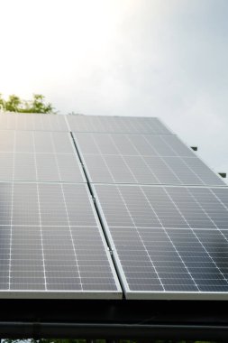 New ecologic house with solar panels Alternative to conventional energy. The battery is charged from a solar cell Advertisement Green energy Sustainable life Renewable alternative energy 