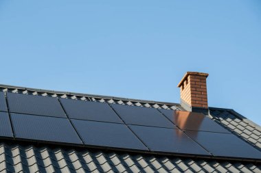 New ecologic house with solar panels Alternative to conventional energy. The battery is charged from a solar cell Advertisement Green energy Sustainable life Renewable alternative energy 