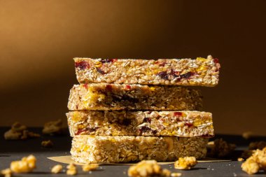 Homemade natural Granola energy bar. Variety of homemade Protein granola breakfast bars with nuts, raisins dried cherries and chocolate. Healthy nutrition eating. Gluten free cereal dieting snack super food Sport oatmeal bar Vegan dessert concept