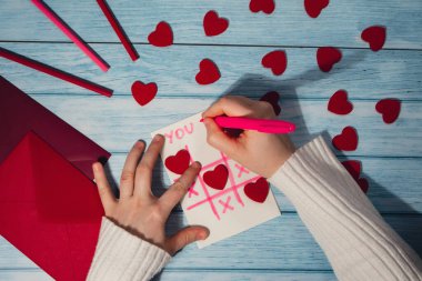 Valentines Day. Instructions for making valentine cards. Text YOU WON MY HEART and tic tac toe game Postcard craft, greeting card. DIY Step by step instruction. Making of handmade Valentine greeting card hobby concept, gift with your own hands.