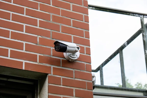 Close-up Of Security Camera On private building. Focus on security CCTV camera monitoring system with panoramic view. Technology concept. Surveillance video equipment outdoor safety system area control. Private property protection. CCTV on location