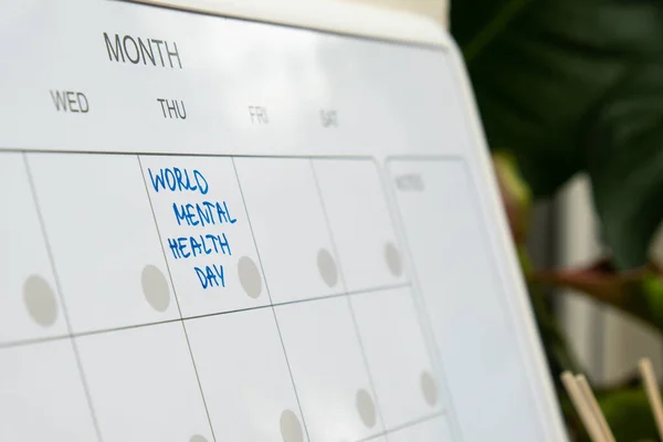 WORLD MENTAL HEALTH DAY on calendar to remind important event or holiday appointment Monthly PLANNER. Magnetic board with the days of the month. Place to enter important matters schedule. Concept for business planning. Whiteboard Planner magnetic mon