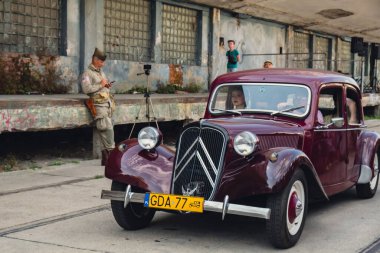 Hel, Poland - August 2022 Old cars Military troops marching during 3 May Polish Constitution Day ceremonial patriotic parade. Polish armed forces tanker military parade. Old guns and cars. Feast of