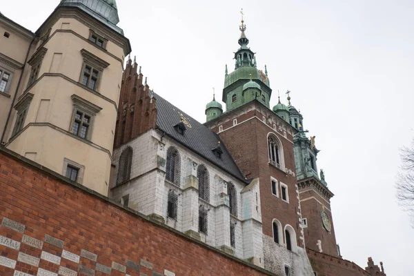 Royal Wawel royal castle in Krakow in rainy early spring weather in Poland. historic castle in the old city Gardens and cathedra, Cracow, Poland. Travel attraction tourist destination
