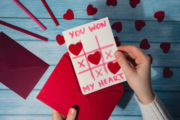 Valentines Day. Instructions for making valentine cards. Text YOU WON MY HEART and tic tac toe game Postcard craft, greeting card. DIY Step by step instruction. Making of handmade Valentine greeting