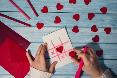 Valentines Day. Instructions for making valentine cards. Text YOU WON MY HEART and tic tac toe game Postcard craft, greeting card. DIY Step by step instruction. Making of handmade Valentine greeting
