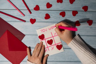 Valentines Day. Instructions for making valentine cards. Text YOU WON MY HEART and tic tac toe game Postcard craft, greeting card. DIY Step by step instruction. Making of handmade Valentine greeting