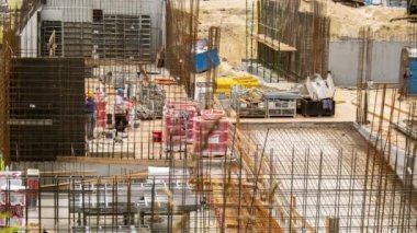 Gdansk, Poland - May 2022. Time lapse Work at the construction site of multi-storey building. Building of residential house or commercial real estate. Cranes on construction site build apartment
