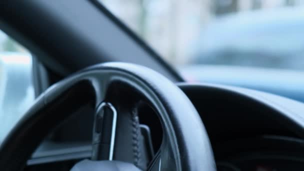 Selective Focus Mans Hand Steering Wheel Driving Car Winter Background — стоковое видео