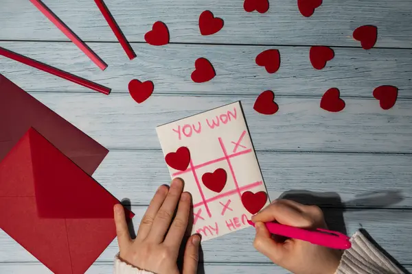 Valentines Day. Instructions for making valentine cards. Text YOU WON MY HEART and tic tac toe game Postcard craft, greeting card. DIY Step by step instruction. Making of handmade Valentine greeting