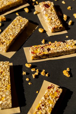 Homemade Granola energy bar. Variety of homemade Protein granola breakfast bars, with nuts, raisins dried cherries and chocolate. Healthy nutrition eating. Gluten free cereal dieting snack super food