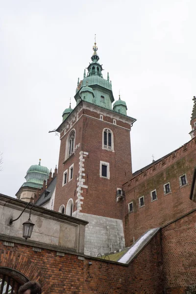 Royal Wawel royal castle in Krakow in rainy early spring weather in Poland. historic castle in the old city Gardens and cathedra, Cracow, Poland. Travel attraction tourist destination