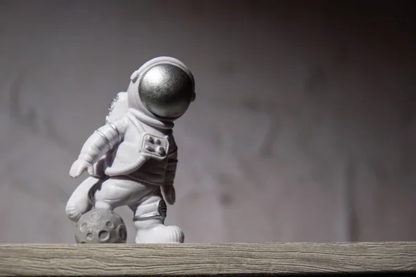 Plastic Toy Figure Astronaut Moon Concrete Background Copy Space Concept — Stockfoto